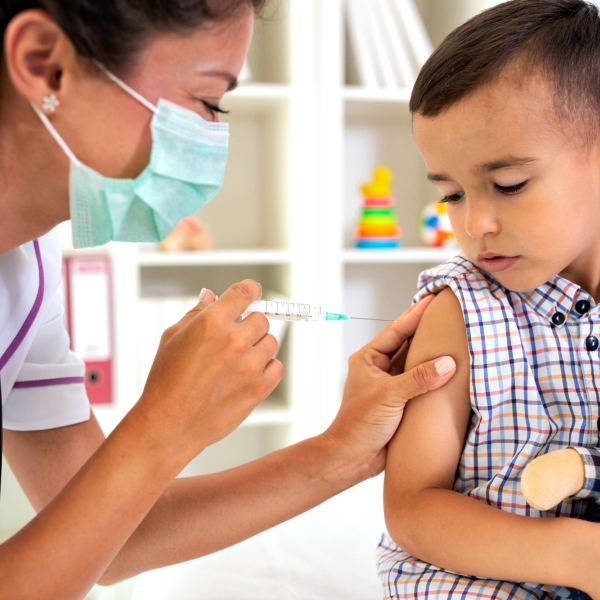 Doctor vaccinating child